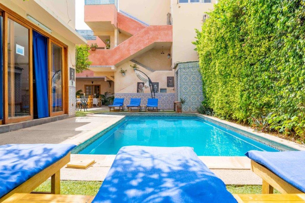 a swimming pool in the backyard of a house at Casa Mara Dakar in Dakar