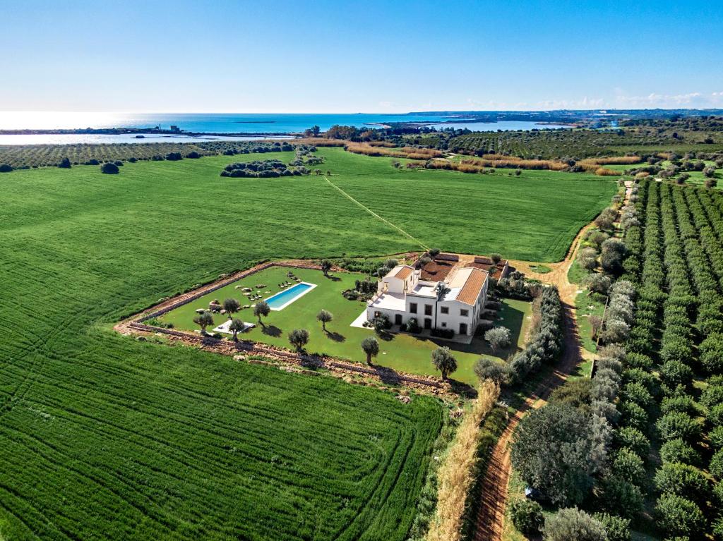 an aerial view of a large house in a field at Casa Vendicari Boutique Hotel in Noto