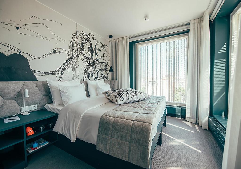 Ένα ή περισσότερα κρεβάτια σε δωμάτιο στο Hotel AX