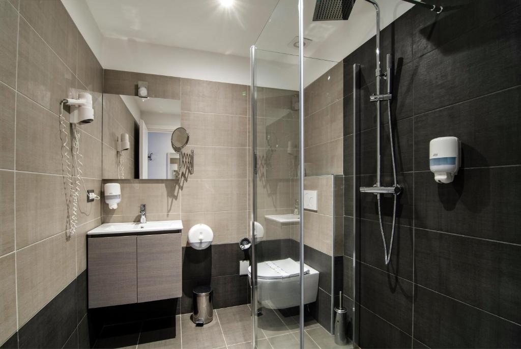 Koupelna v ubytování Hotel Saligari