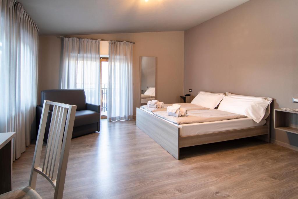 Postel nebo postele na pokoji v ubytování Hotel Saligari