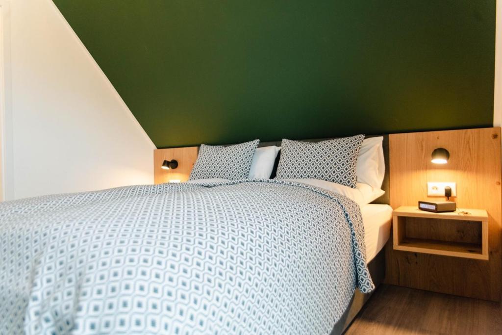 Postel nebo postele na pokoji v ubytování Küsten Apartments Tannenhausen