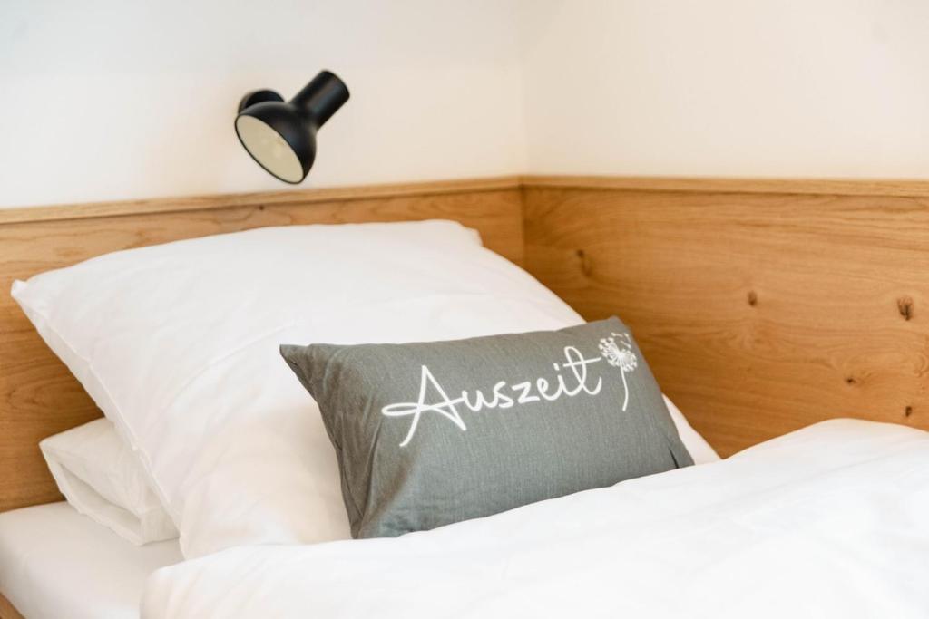 Postel nebo postele na pokoji v ubytování Küsten Apartments Tannenhausen
