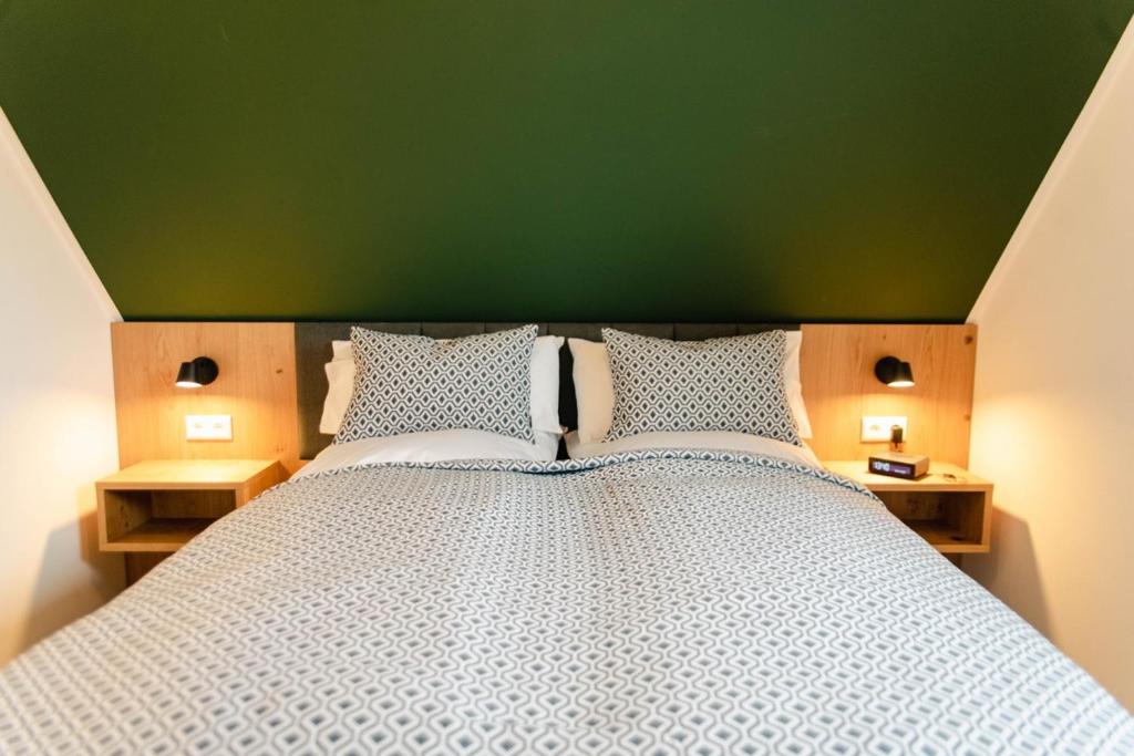 Postel nebo postele na pokoji v ubytování Küsten Apartments Tannenhausen