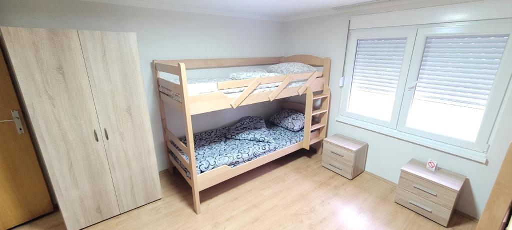 Postel nebo postele na pokoji v ubytování Apartman Progresso