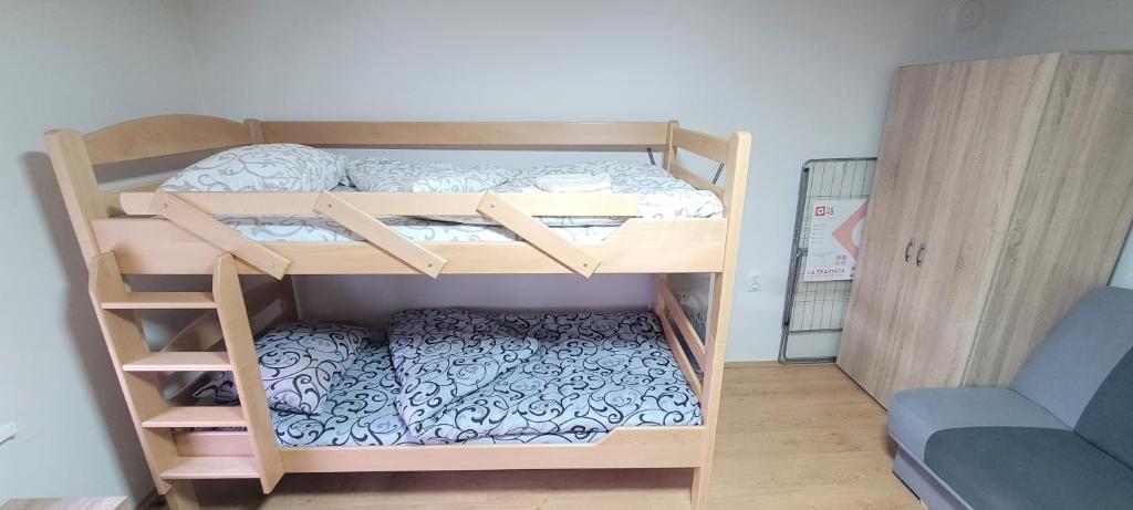 Postel nebo postele na pokoji v ubytování Apartman Progresso