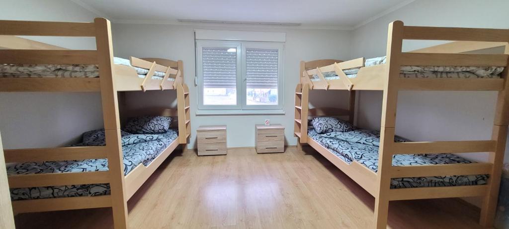 Postel nebo postele na pokoji v ubytování Apartman Progresso