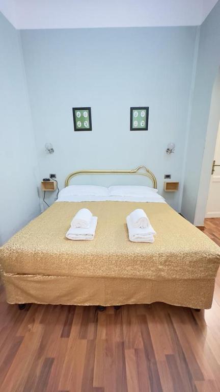 Postel nebo postele na pokoji v ubytování PICCOLO HOTEL Nel Centro Storico di Firenze
