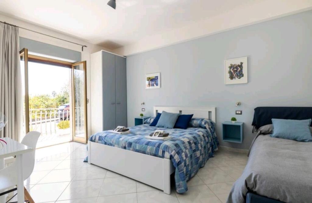Postel nebo postele na pokoji v ubytování B&B TERRA DI MITI