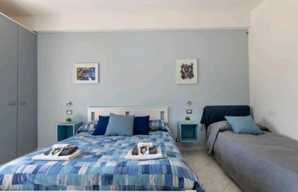 Postel nebo postele na pokoji v ubytování B&B TERRA DI MITI