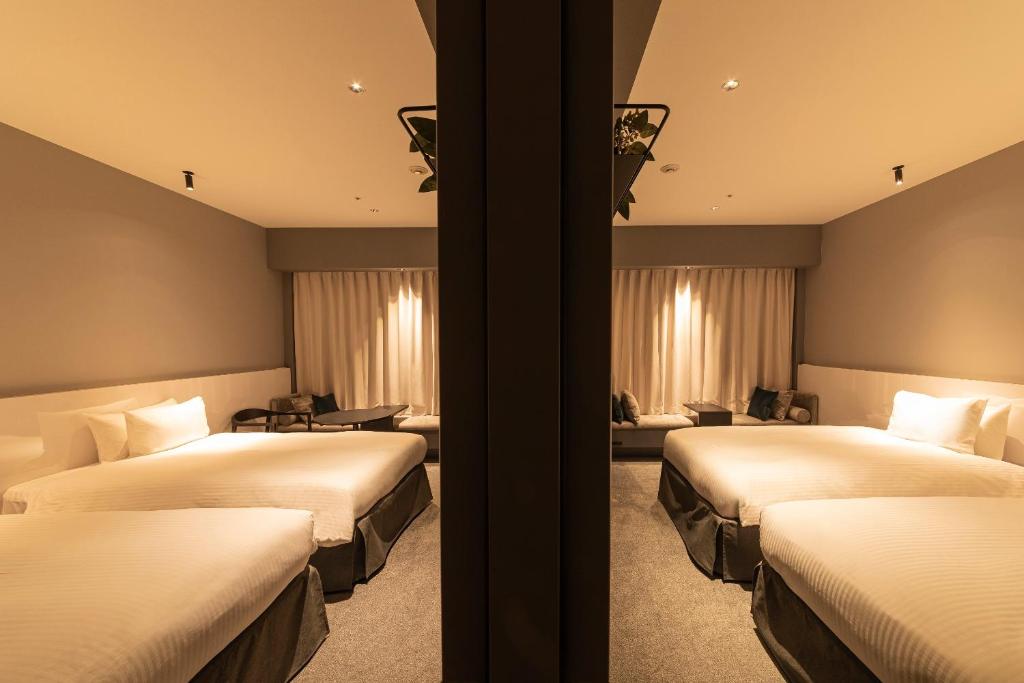 Postel nebo postele na pokoji v ubytování Hotel Keihan Namba Grande