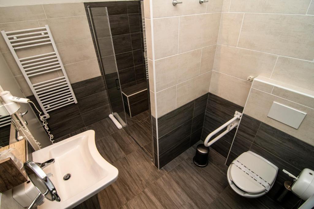 Koupelna v ubytování Hotel Saligari