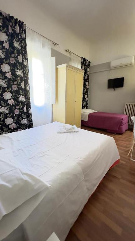 Postel nebo postele na pokoji v ubytování PICCOLO HOTEL Nel Centro Storico di Firenze
