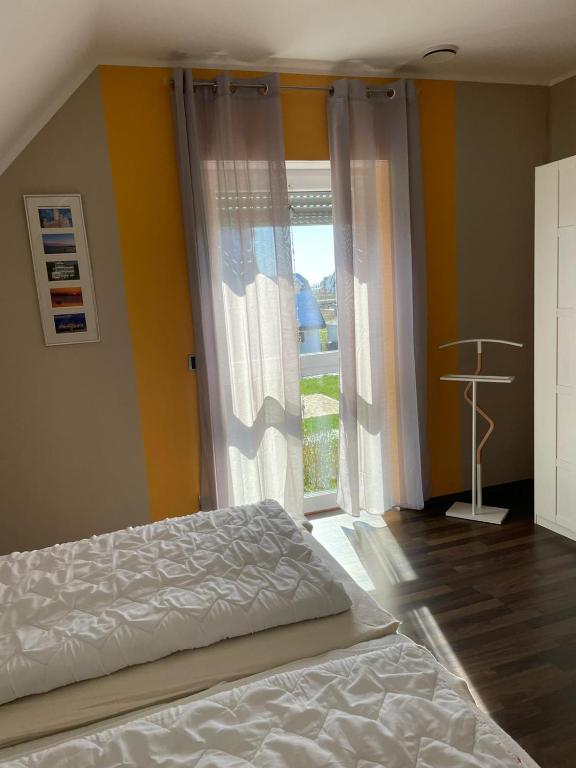 Postel nebo postele na pokoji v ubytování Villa Ostseewelle