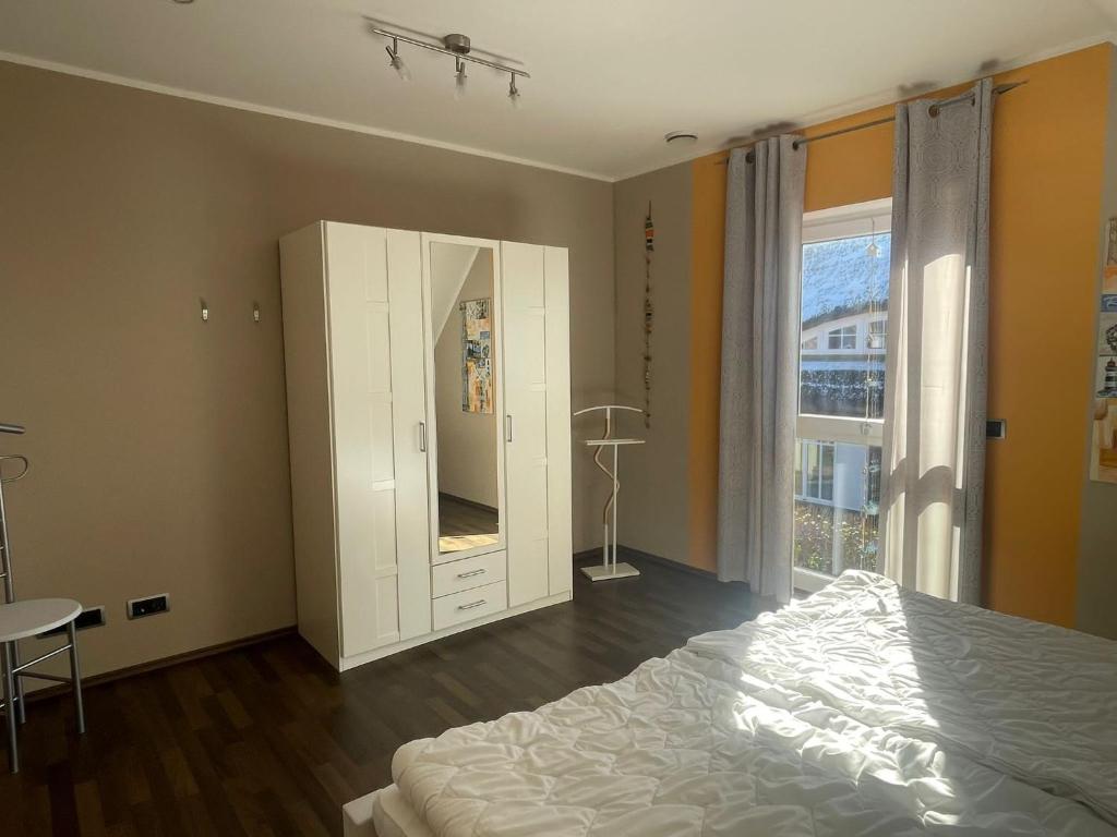 Postel nebo postele na pokoji v ubytování Villa Ostseewelle