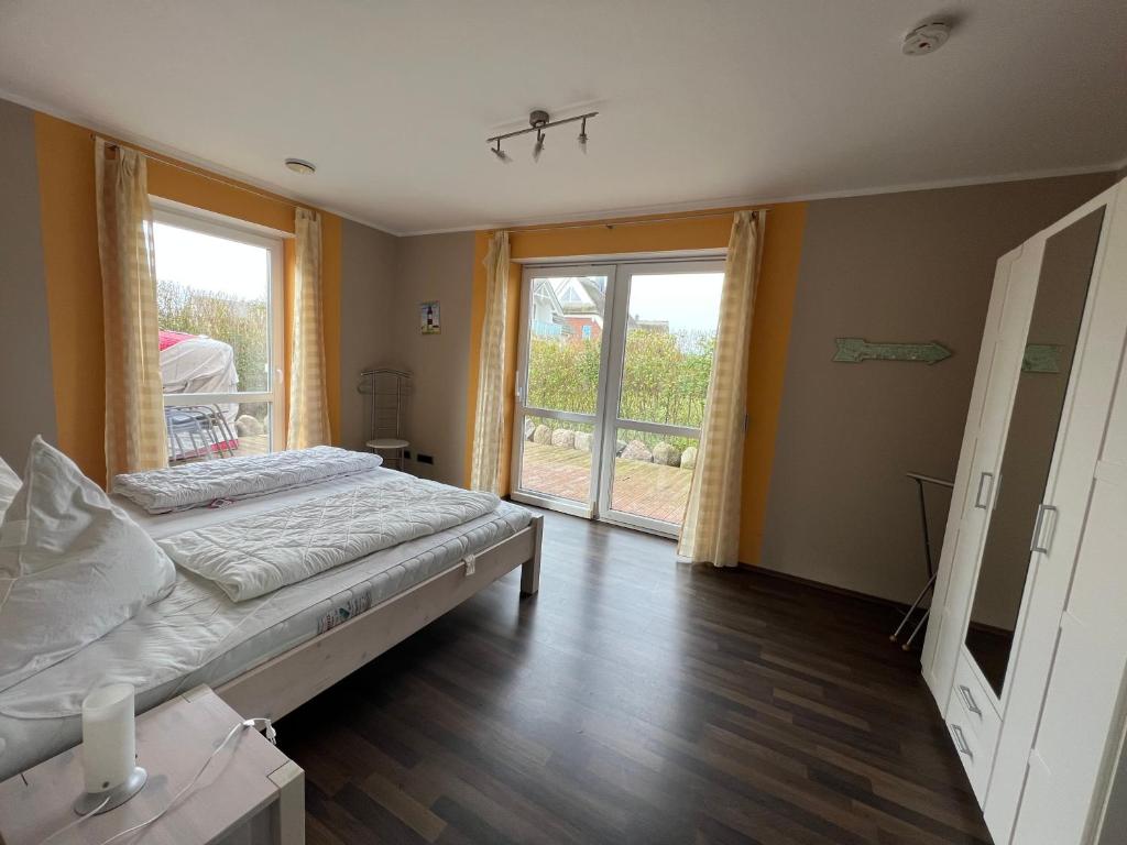 Postel nebo postele na pokoji v ubytování Villa Ostseewelle