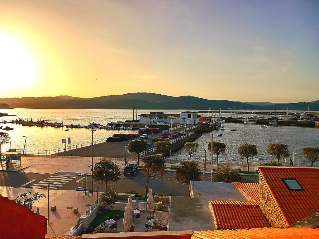 a view of a marina with boats in the water at Hotel Puerto Arnela in Camariñas