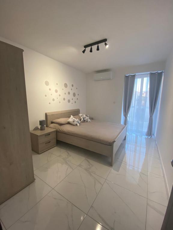 Postel nebo postele na pokoji v ubytování Central, Bright & Modern Apartment