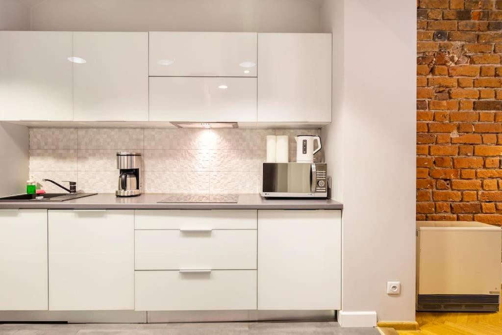 Kuchyňa alebo kuchynka v ubytovaní Floriańska Glamour Apartments
