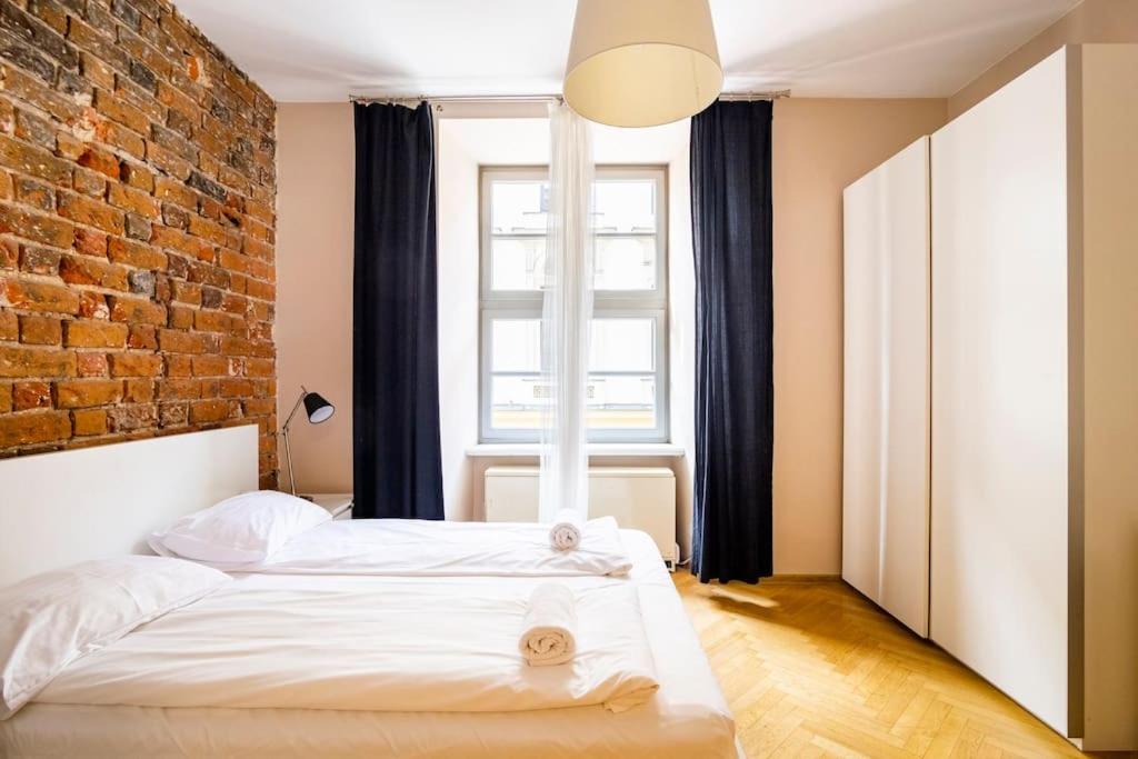 Posteľ alebo postele v izbe v ubytovaní Floriańska Glamour Apartments