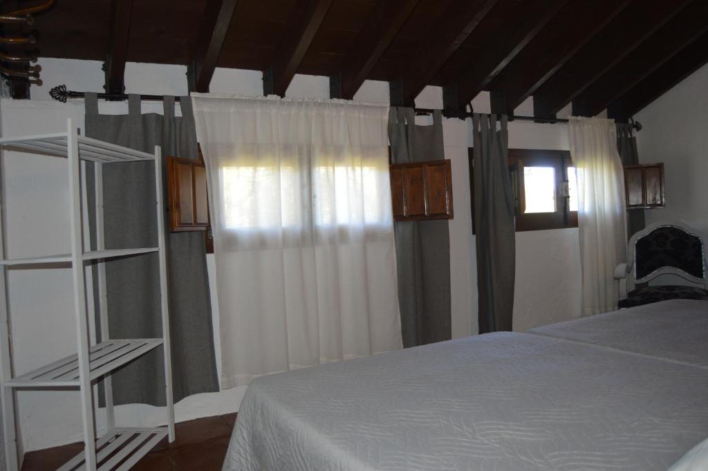 Postel nebo postele na pokoji v ubytování Cortijo Molino los Justos