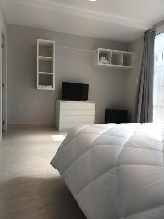 Postel nebo postele na pokoji v ubytování Hostal Cerro del Castillo jumilla