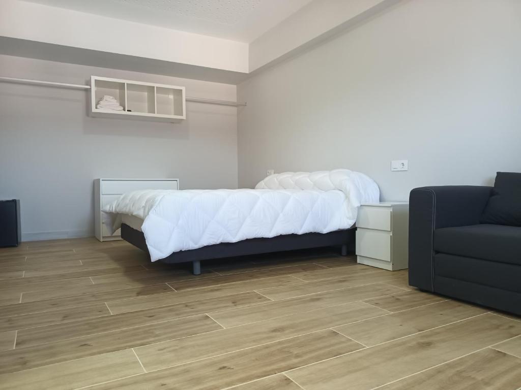Postel nebo postele na pokoji v ubytování Hostal Cerro del Castillo jumilla