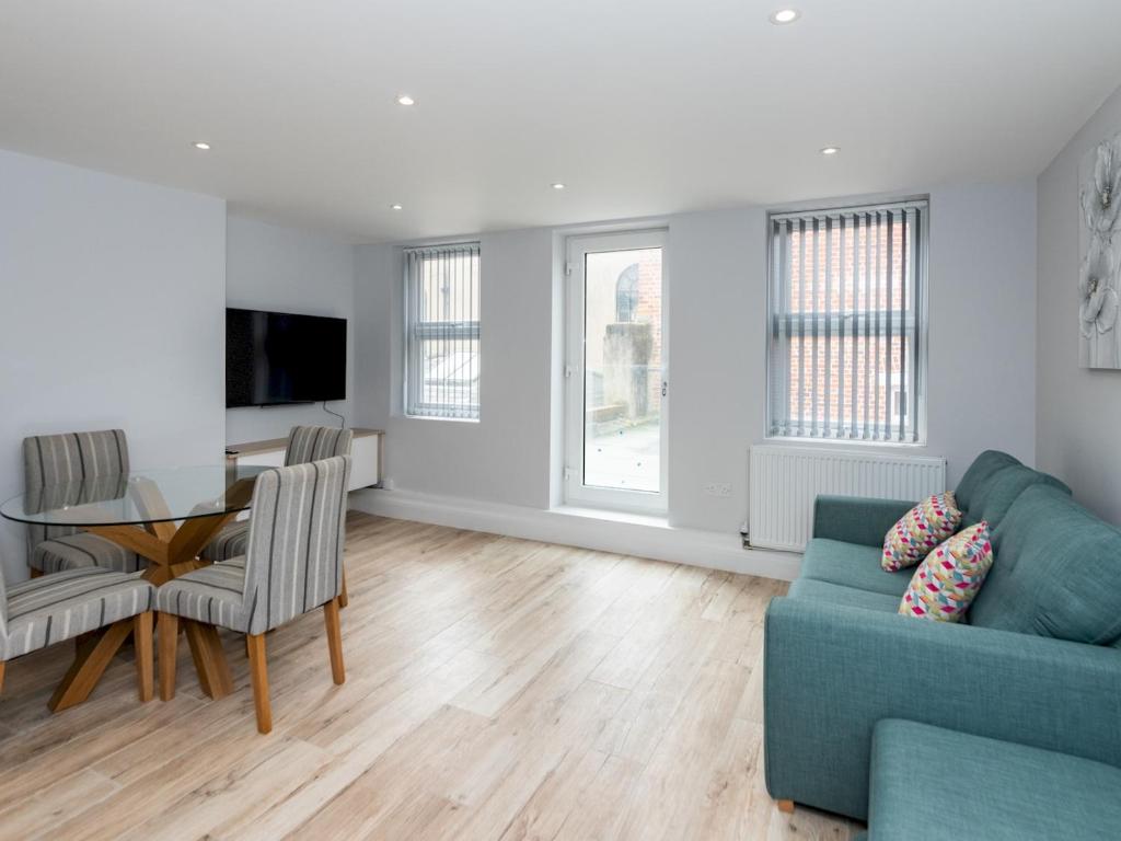 a living room with a couch and a table at Pass the Keys Brand New Stylish 2BR Flat in Reading Centre in Reading