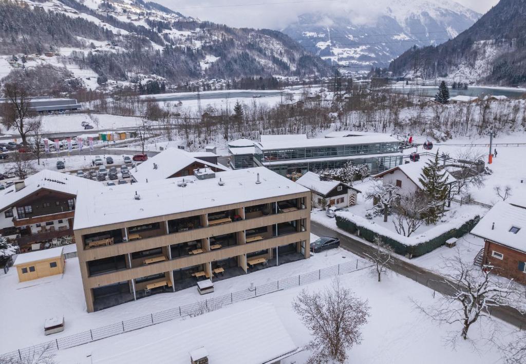 a building in a town with snow on the ground at Haus Fontanas by Emju - Vandans in Vandans