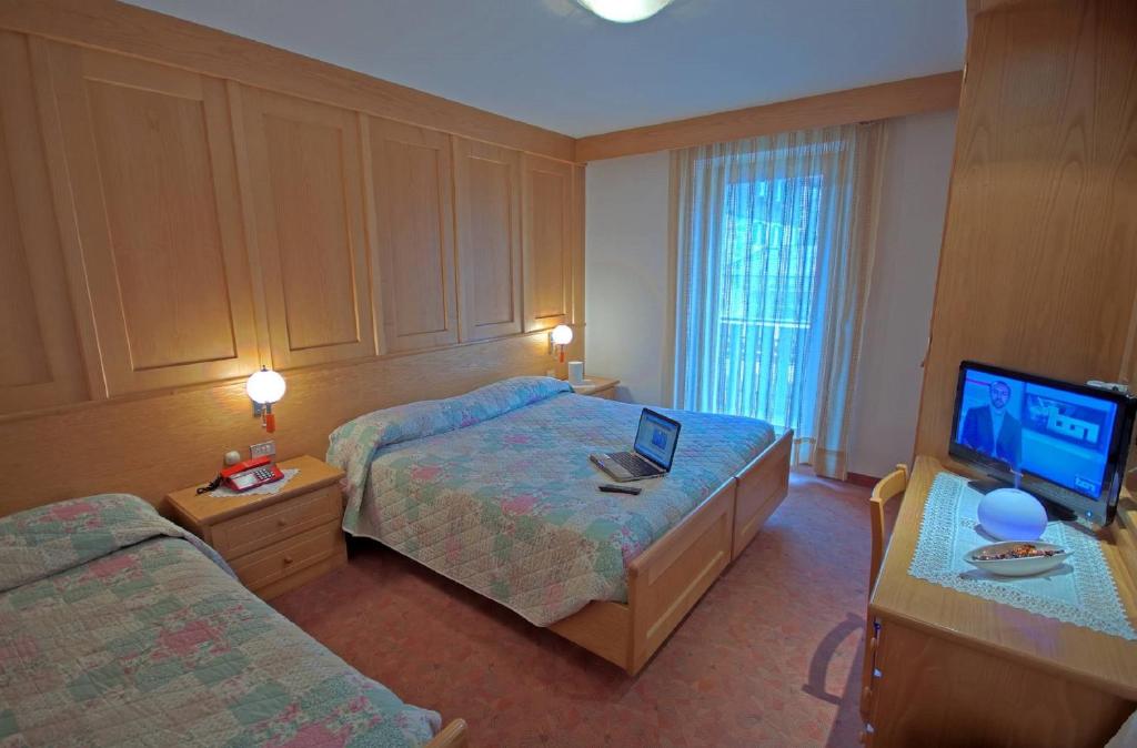 Postel nebo postele na pokoji v ubytování Hotel De Fronz