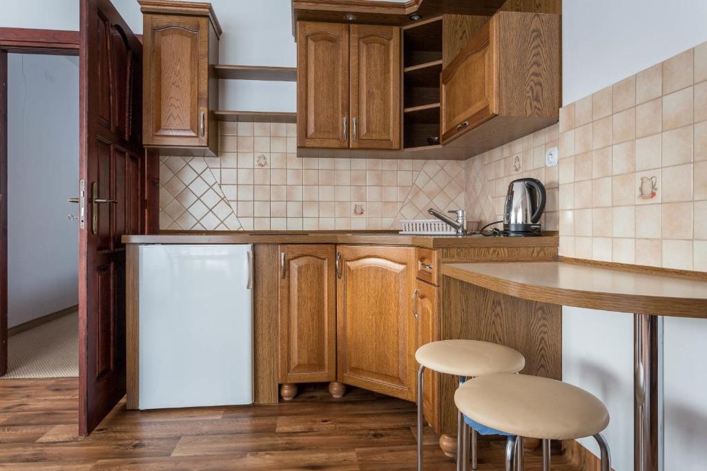Kuchyňa alebo kuchynka v ubytovaní Sykowny Dworek Apartamenty