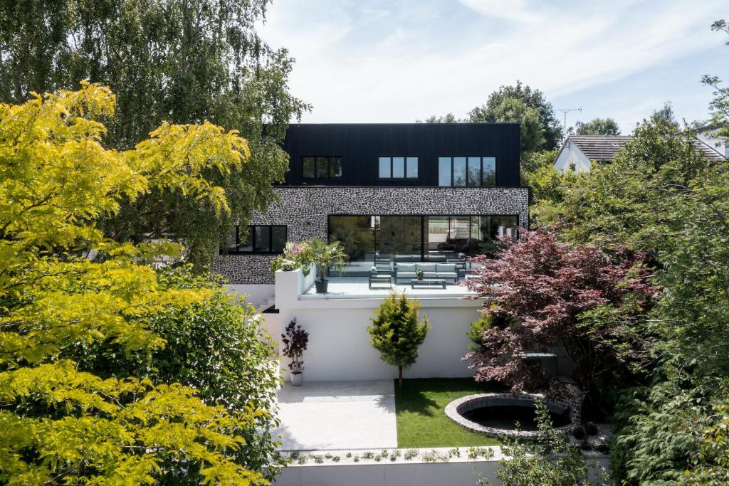 a house with a garden in front of it at Grand Designs Chess Valley Project - Rickmansworth in Rickmansworth