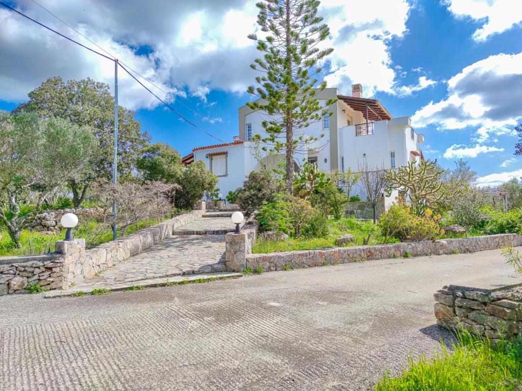 a house on the side of a road at Minos's House in Kathiana