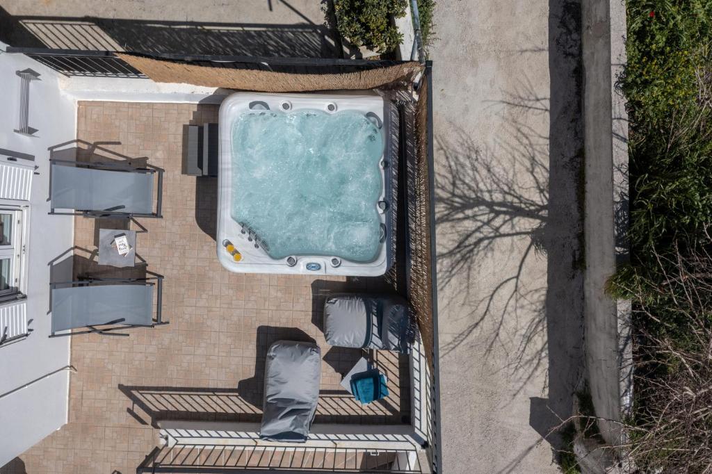 an overhead view of a swimming pool on a house at Aggeliki House in Kissós