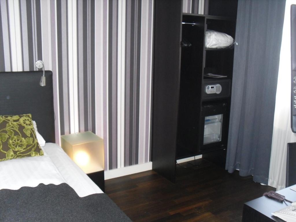 Postel nebo postele na pokoji v ubytování First Hotel Witt
