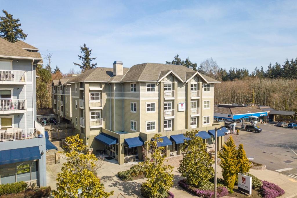 an aerial view of a hotel with a parking lot at Marshall Suites in Bainbridge