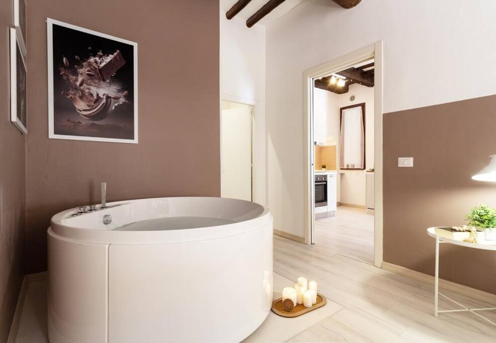 a bathroom with a white tub in a room at Flat with whirlpool bath in the historic centre in Perugia