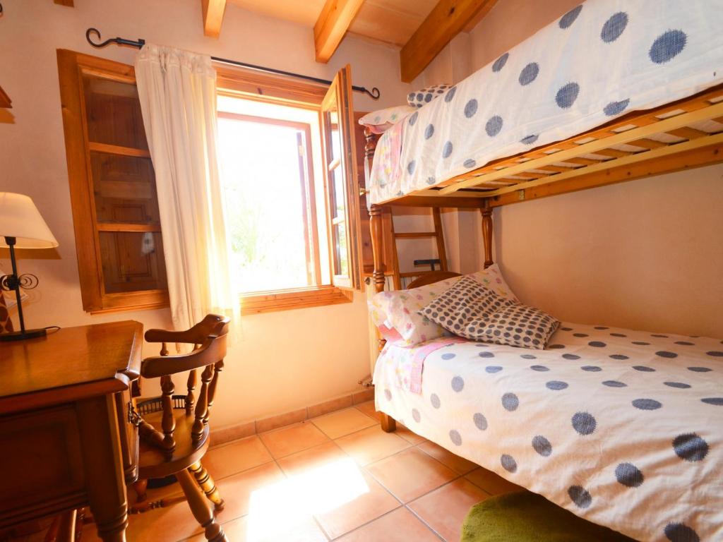 A bed or beds in a room at Can Rovey, pool and gardens in Inca