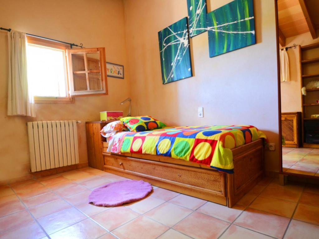 A bed or beds in a room at Can Rovey, pool and gardens in Inca