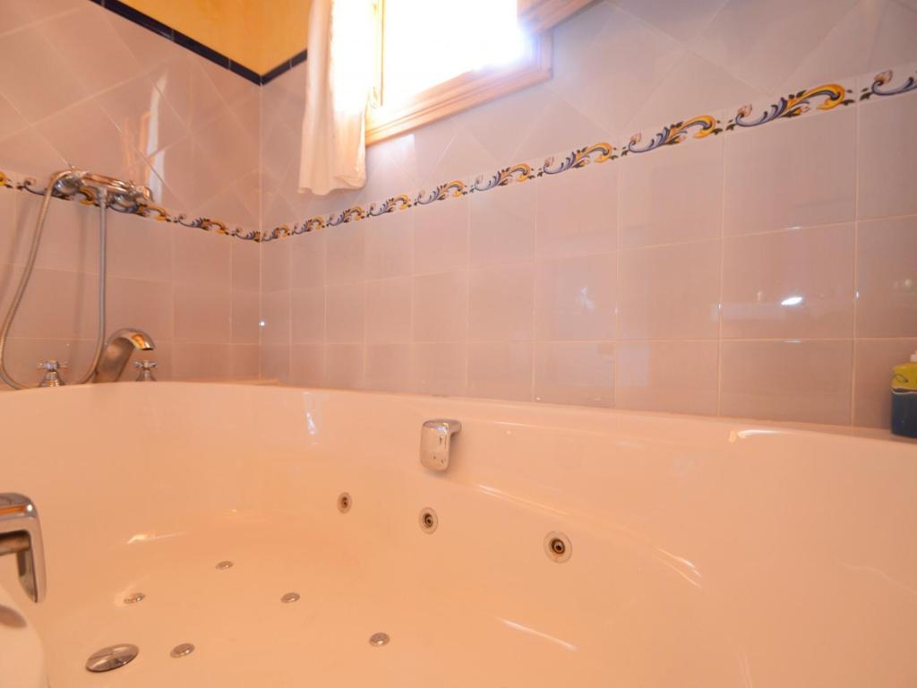 A bathroom at Can Rovey, pool and gardens in Inca