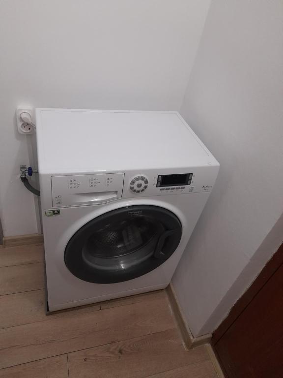 a washing machine with a white counter top at Bega Cirumvalatiunii One Room Apartment- 4 in Timişoara