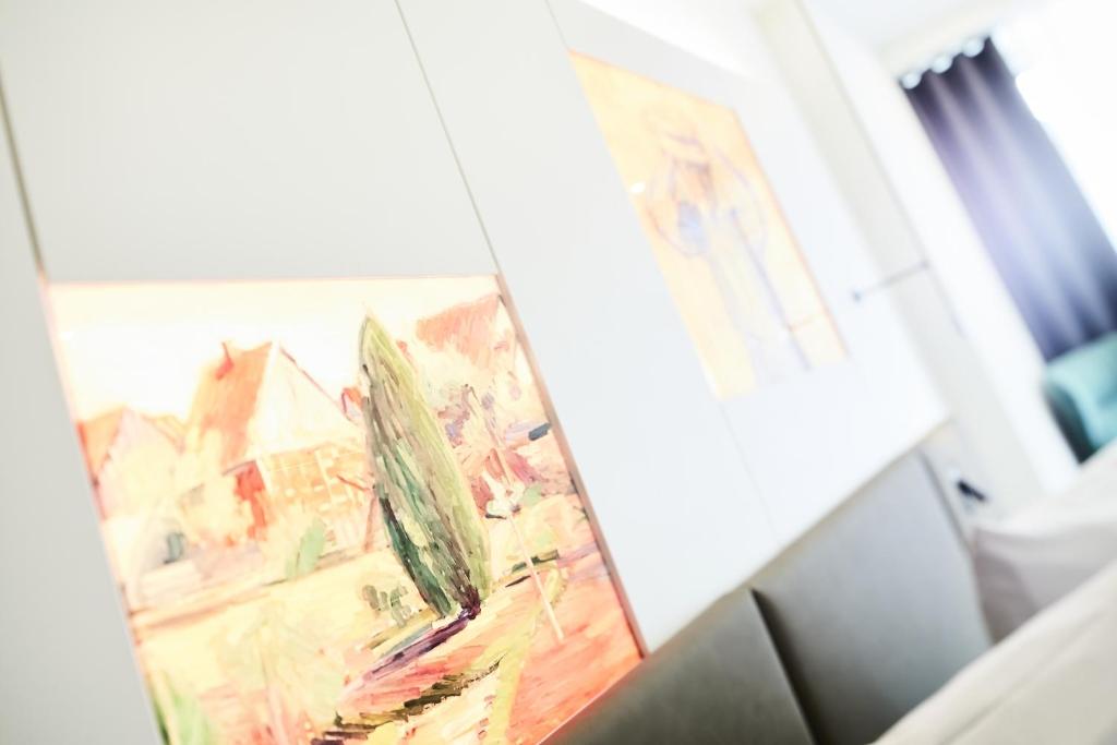 Postel nebo postele na pokoji v ubytování Design- und Kunsthotel München