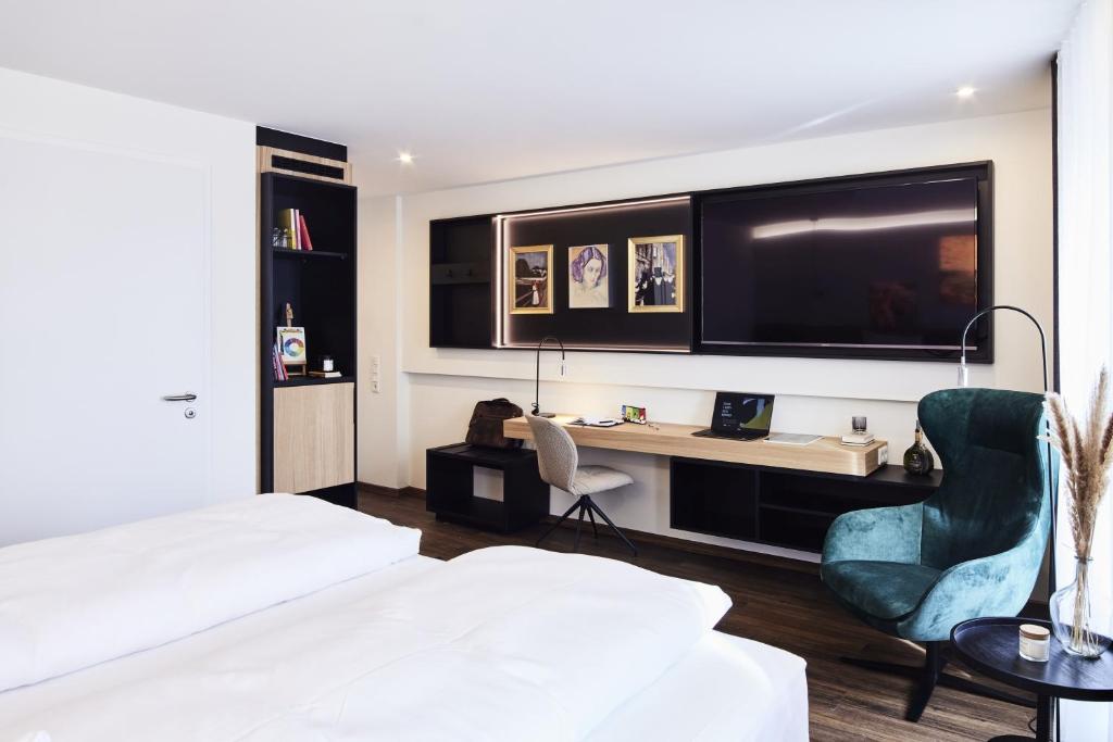 Postel nebo postele na pokoji v ubytování Design- und Kunsthotel München