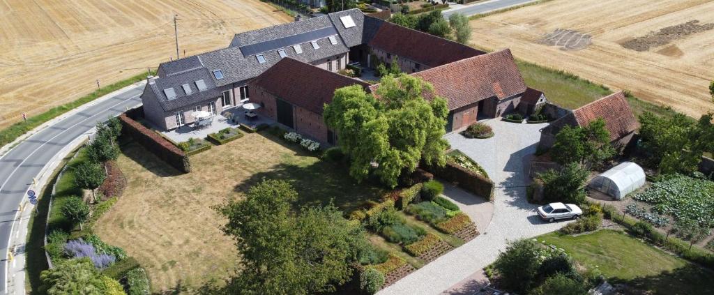 an aerial view of a large house with a yard at Hermelgemhoeve - Liriope in Zwalm