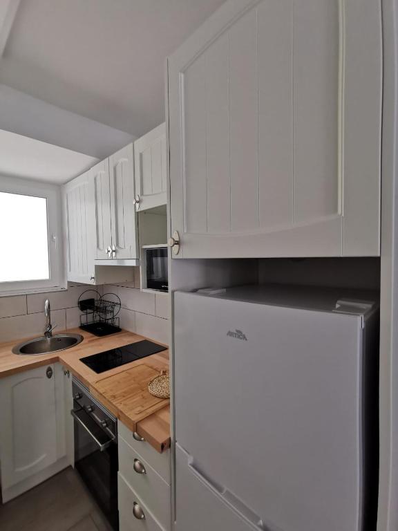 A kitchen or kitchenette at Casa playa