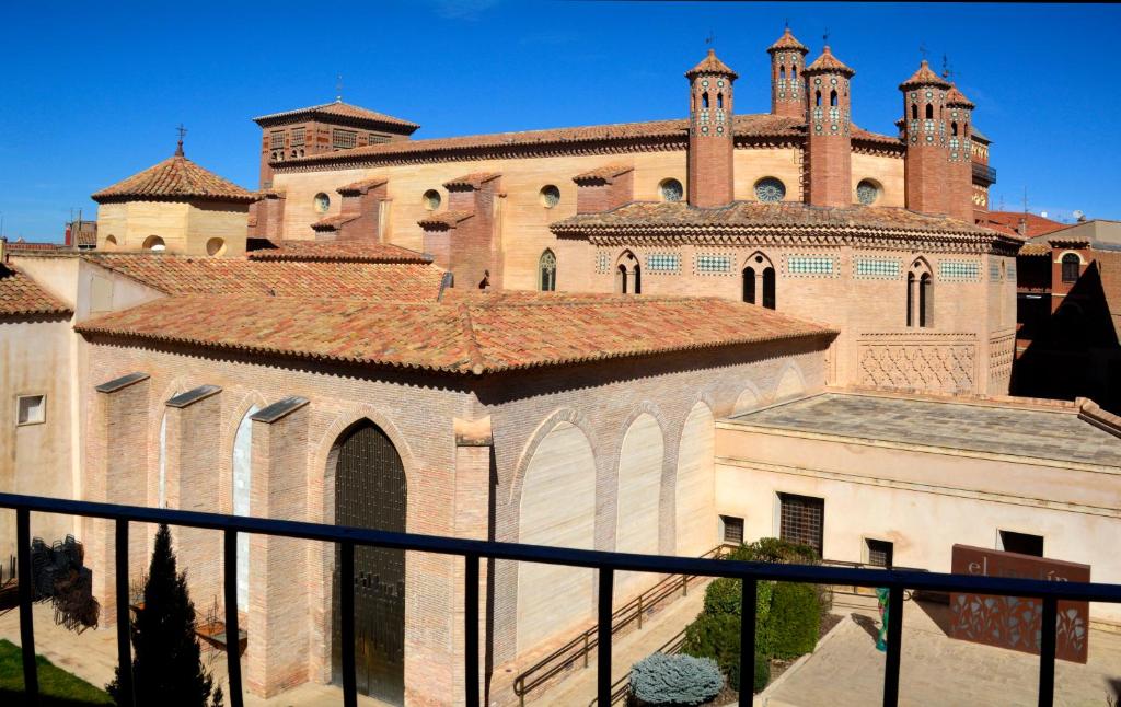 a large building with turrets and a roof at Mirador de los Amantes - VUTE-23-019 in Teruel