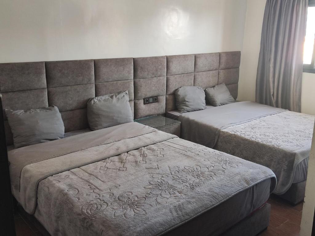 Postel nebo postele na pokoji v ubytování Hôtel Saâda