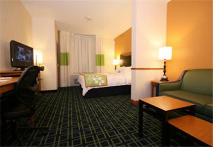 a hotel room with two beds and a television at Fairfield Inn and Suites White River Junction in White River Junction