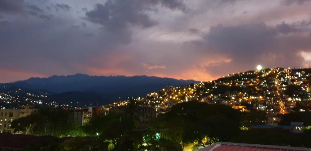 a view of a city at night at El mejor en Cali Espectacular apto 3A zona sur in Cali