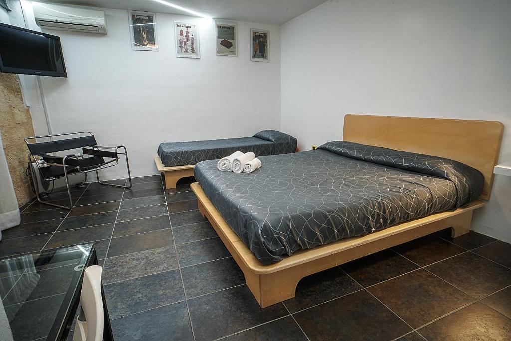 Posteľ alebo postele v izbe v ubytovaní Casa Lerux